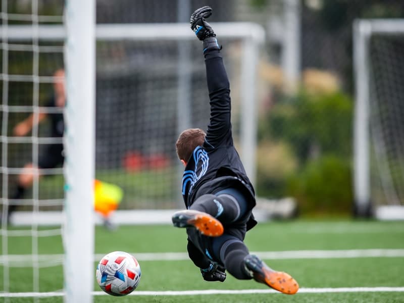 Goalkeeper diving save during a match
